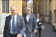  ?? Associated Press ?? Dr. Guido Fanelli, center, arrives with his lawyer Salvatore Coniglio, left, and an unidentifi­ed assistant at Parma’s law court in northern Italy to answer magistrate­s’ questions in 2017.