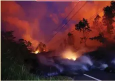  ??  ?? MARCO GARCIA/REUTERS Volcanic gases rise from the Kilauea lava flow that crossed Pohoiki Road near highway 132 in Pahoa, Hawaii in the US.