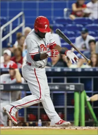  ?? WILFREDO LEE — THE ASSOCIATED PRESS ?? The Phillies’ Odubel Herrera reacts to a close pitch during the sixth inning Marlins, Wednesday in Miami. The Marlins defeated the Phillies, 11-1. against the