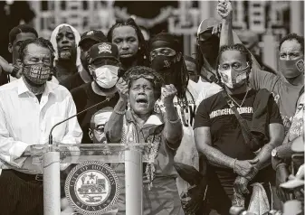  ?? Elizabeth Conley / Staff photograph­er ?? U.S. Rep. Sheila Jackson Lee addresses thousands of protesters at a march honoring George Floyd last Tuesday in downtown Houston. She is leading a police reform effort in the House.
