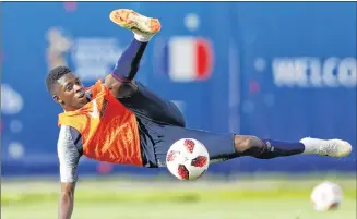  ?? AP PHOTO ?? France’s Ousmane Dembele attempts a shot at goal during a training session Saturday at the World Cup in Russia.