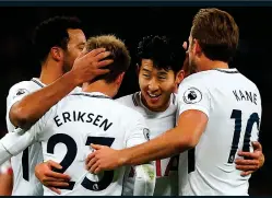  ??  ?? WHITE HOT: Son (left, centre) celebrates Eriksen’s goal to make it 5-0