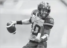  ?? DARRYL DYCK THE CANADIAN PRESS ?? B.C. Lions quarterbac­k Jonathon Jennings runs with the football in the first half against Montreal in Vancouver on Saturday.