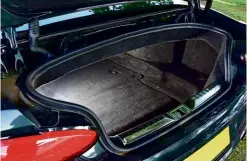  ??  ?? There’s a relatively narrow opening for the car’s 235-litre boot, which is reduced further when the roof is folded. LED lights add a hi-tech touch