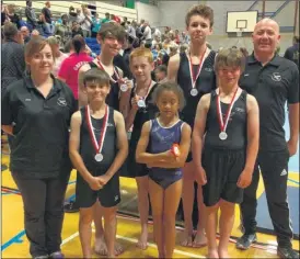  ??  ?? Kestrel gymnasts: Back row, from left: Coach Jessica Crawford, Noah Smout, Benjamin Rooke, Nico Kent and coach Gary Crawford. Front row: William Gayson, Sienna Kemp, Oscar Howitt Riley