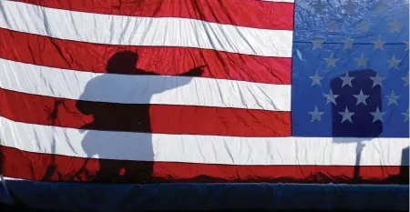  ?? TYLER TJOMSLAND AP/The Spokesman-Review ?? Oath Keepers founder Stewart Rhodes at a 2013 rally in Coeur d’Alene, Idaho.