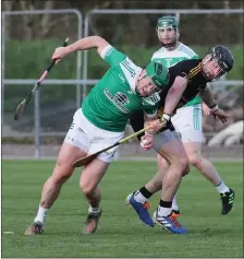  ?? ?? Rory Porteous is dragged back by Cormac Munroe during Lisbellaw’s defeat to Carrickmor­e.