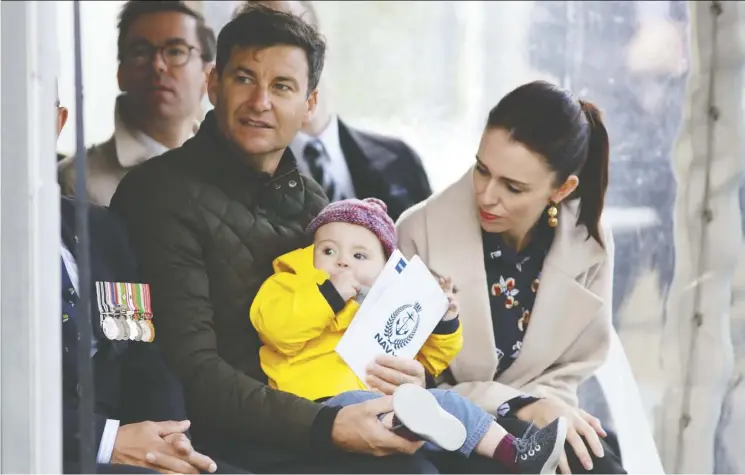  ??  ?? New Zealand Prime Minister Jacinda Ardern, shown with her partner Clarke Gayford and their child Neve, is able to juggle work and home life better than most.
Phil Walter/getty images