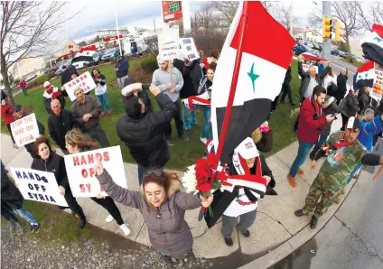  ??  ?? SUPPORT. Crowd chants during a rally in opposition to the US missile strikes in Syria. Allentown, Pensylvani­a us Christian but they do support Syrian President Bashar alAssad.