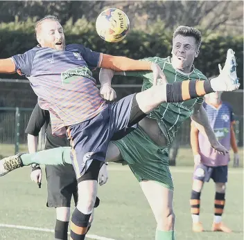  ??  ?? Action from Yaxley’s 6-3 defeat at home to Bromsgrove Sporting (green) in the Evo Stik Southern League.