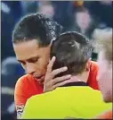  ??  ?? Private moment: Van Dijk comforts referee who has lost his mother
