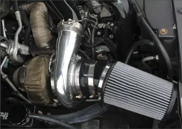  ??  ??  The built Duramax takes its first breaths through a Borgwarner S488 SX-E, which serves as the atmospheri­c charger (low-pressure) in the truck’s compound turbo arrangemen­t. The 88mm unit has been lauded for its impressive flow numbers (a whopping 160...