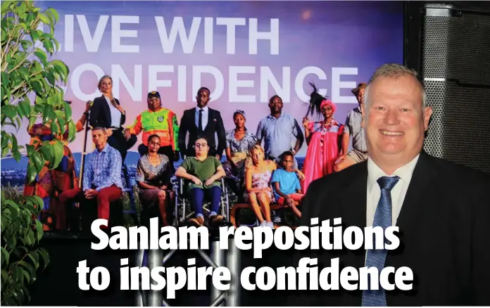  ?? Photo: Paheja Siririka. ?? With confidence…Tertius Stears in front of a poster depicting Sanlam’s brand reposition­ing.