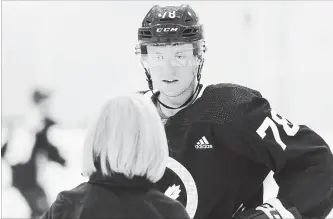  ?? RENE JOHNSTON
TORONTO STAR ?? Rasmus Sandin talks to skating consultant for the Toronto Maple Leafs, Barb Underhill, while on the ice at the National Hockey League team’s training facility in Etobicoke on Tuesday.