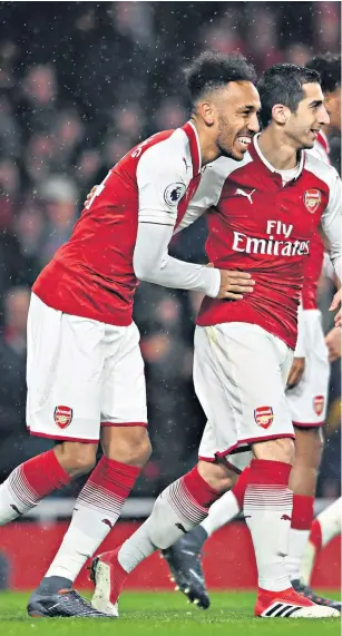  ??  ?? Dynamic duo: Pierre-emerick Aubameyang and Henrikh Mkhitaryan, centre, celebrate a winning start