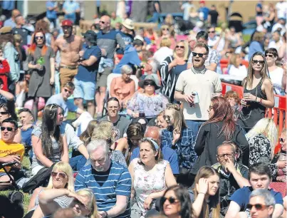  ?? Picture: Kim Cessford. ?? WestFest revellers enjoying the event in the sunshine last year.