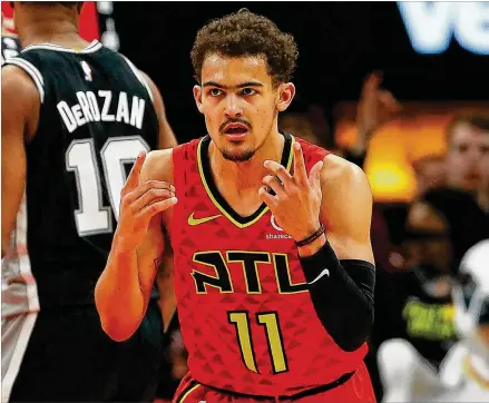  ?? KEVIN C. COX / GETTY IMAGES ?? In a sign of the Hawks’ nascent comeback, Trae Young has a semirealis­tic shot at rookie of the year. But what about next season? “I think we’ll have a really good chance to be in the playoffs next year because of the growth we’ve shown this year,” he says.