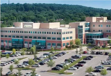  ??  ?? Health Management Associates, a for-profit chain based in Naples, Fla., last year acquired seven hospitals from Mercy Health Partners-tennessee. One of those facilities, left, is now named Turkey Creek Medical Center, in Knoxville, Tenn.