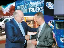  ?? AP-Yonhap ?? Ford Motor President and CEO, Jim Hackett, left, meets with Dr. Herbert Diess, CEO of Volkswagen AG, Monday, at the North American Internatio­nal Auto Show in Detroit.