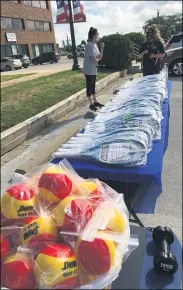  ?? RICHARD PAYERCHIN - THE MORNING JOURNAL ?? The U.S. Tennis Associatio­n, its Northeaste­rn Ohio Tennis Associatio­n chapter and Lorain County Community College joined to supply free tennis racquets and foam practice balls to Lorain-area youths this summer. The giveaways happened this week with the final gathering held July 31, at the LCCC Lorain Learning Center.