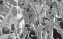  ?? AP Photo/Andrew Medichini ?? ■ Pope Francis arrives for his weekly audience Wednesday at the Vatican.