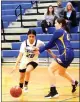  ?? ?? Lower Lake's Samantha Hernandez brings the ball down the floor for the Trojans against Cloverdale.