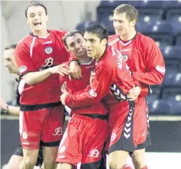  ??  ?? Winner Andy Dorman celebrates with his teammates