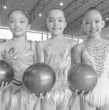  ??  ?? Team Cebu City's Ziah Tajanlangi­t, Leanne Marie Manning and Leann Mae Lubang pose after a dominating performanc­e in the gymnastics event of 2019 Central Visayas Regional Athletic Associatio­n(CVIRAA) Meet yesterday in Dumaguete City.