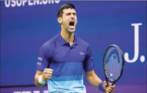  ?? John Minchillo / Associated Press ?? Novak Djokovic reacts after scoring a point against Alexander Zverev during the U.S. Open semifinals on Friday.