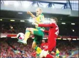  ??  ?? Liverpool’s Andrew Robertson (right), and Norwich City’s Teemu Pukki fight for the ball during the English Premier League soccer match between Liverpool and Norwich City at Anfield in Liverpool, England on Aug 9. (AP)