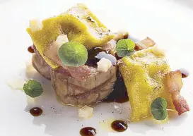  ??  ?? Grilled Berkshire pork tenderloin with squash ravioli, bacon, mustard seed, pickled yakon and tarragon butter.