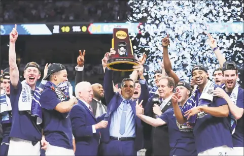  ?? Tom Pennington / Getty Images ?? UConn will face defending national champion Villanova and coach Jay Wright on Dec. 22 at Madison Square Garden in New York.