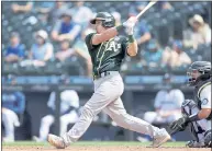  ?? JOHN FROSCHAUER — THE ASSOCIATED PRESS ?? A’s catcher Sean Murphy delivers a game-tying RBI double in the eighth inning against the Mariners on Monday in Seattle.