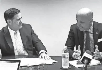  ?? TOM TINGLE/THE REPUBLIC ?? A week after their first public debate, gubernator­ial candidates Doug Ducey, left, and David Garcia visited The Arizona Republic’s editorial board for a joint interview that was lighter on insults and heavier on policy plans.