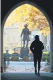  ?? MEDIANEWS GROUP FILE PHOTO ?? A student makes her way through the Philips Memorial Building gateway into the Quad at West Chester University.