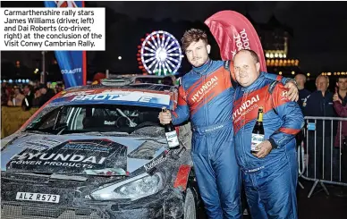  ?? ?? Carmarthen­shire rally stars James Williams (driver, left) and Dai Roberts (co-driver, right) at the conclusion of the Visit Conwy Cambrian Rally.