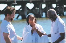  ??  ?? STAFF PHOTO BY TAMARA WARD Leah Onuoha prays moments before her baptism in the Chesapeake Bay at the Community Holy Baptism event held in North Beach on Aug. 13. Onuho, who was renewing her baptism, gave the honors to her father, the Rev. Joe Jimerson,...