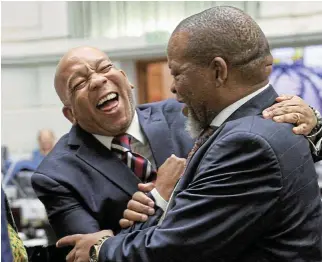  ?? /Reuters ’ ?? Let there be light: Mineral resources & energy minister Gwede Mantashe, right, and electricit­y minister Kgosientsh­o Ramokgopa share a light-hearted moment ahead of President Cyril Ramaphosa s questionan­d-answer session in the National Assembly, in Cape Town on Thursday.