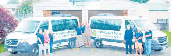  ?? Photo / Dean Taylor ?? Te Awamutu Community Health Transport Trust volunteers and trustees with their vehicles at the garage built by Te Awamutu Lions Club.