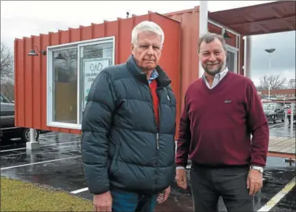  ?? PETE BANNAN — DIGITAL FIRST MEDIA ?? Carlo Castelanel­li and Guillermo Weston in front of their model home made from a shipping container. It can be seen at Great Valley Center at Route 401 and Lancaster Avenue.