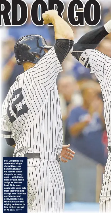  ?? GETTY ?? Didi Gregorius (c.) celebrates his go ahead three-run homer Saturday — his second clutch dinger in as many days — with Chase Headley and Aaron Judge as Yankees bash Birds once again with some help from their own Bird (Greg), who launches one into...