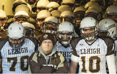  ?? MORNING CALL FILE ?? Lehigh football coach Andy Coen stands in the tunnel with his team before taking the field against Lafayette in 2014 at Yankee Stadium in New York.