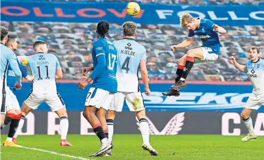  ??  ?? Filip Helander makes it 2-0 for Rangers at Ibrox