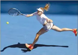  ?? The Associated Press ?? Canada’s Eugenie Bouchard stretches for a forehand return to China’s Peng Shuai during their second round match at the Australian Open tennis championsh­ips in Melbourne, Australia. Bouchard won 7-6 (5), 6-2)