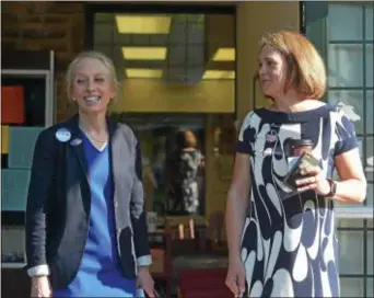  ?? PETE BANNAN — DIGITAL FIRST MEDIA ?? Democratic congressio­nal rivals Mary Gay Scanlon and Ashley Lindenheim­er were both on hand at the Furness Library in Wallingfor­d Tuesday morning to greet voters. The two exchanged hugs before they left.