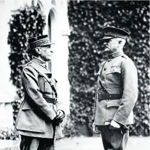  ?? AFP / GETTY IMAGES ?? French Marshal Ferdinand Foch, left, and U.S. Army General John Pershing in the courtyard of Versailles Palace on Nov. 11, 1918.