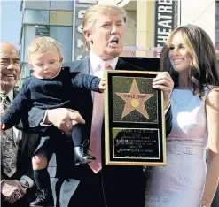  ?? THE ASSOCIATED PRESS FILE PHOTO ?? Donald Trump’s sidewalk star has become an attraction for artists and pro- and anti-Trumpers alike. It’s also been destroyed twice.