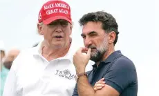  ?? (AP photo/Seth Wenig, File) ?? On July 29, 2022, former President Donald Trump, left, talks with Yasir Al-Rumayyan, governor of Saudi Arabia’s Public Investment Fund, on the 16th hole during the first round of the Bedminster Invitation­al LIV Golf tournament in Bedminster, NJ.