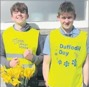  ?? ?? Cian O’Donnell (left) and Niall Fitzgerald, happy to be involved, pictured collecting for Daffodil Day.