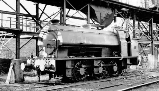  ?? ARMSTRONG PHOTOGRAPH­IC TRUST ?? On June 5 1956, ‘Austerity’ No. 60 stands alongside the sizeable coaling stage at Philadelph­ia sheds on the Lambton Railway. The locomotive will return to County Durham this June.